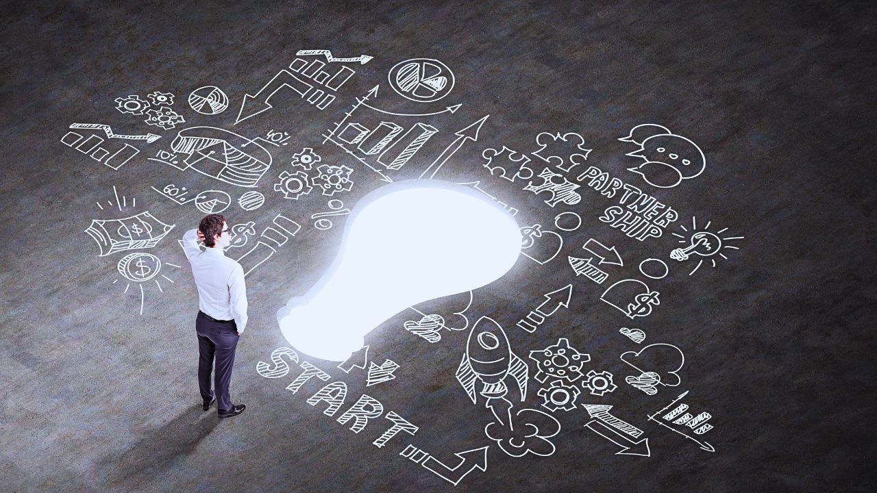 Person standing in front of the word Start, with achievements branching out ahead, on a dark black background symbolizing new beginnings and goals